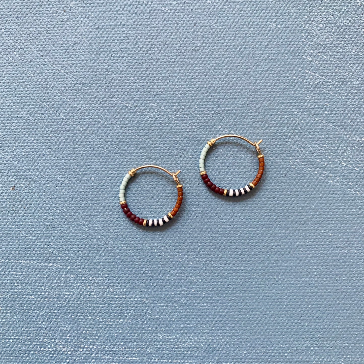 small beaded hoop in earth tone stripes