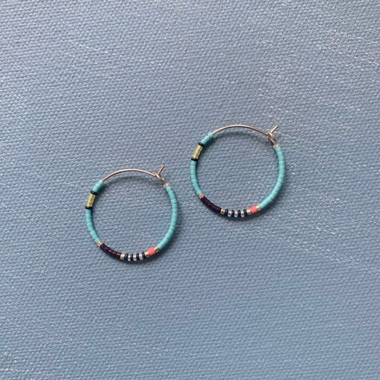 medium beaded hoop earrings in turquoise blue