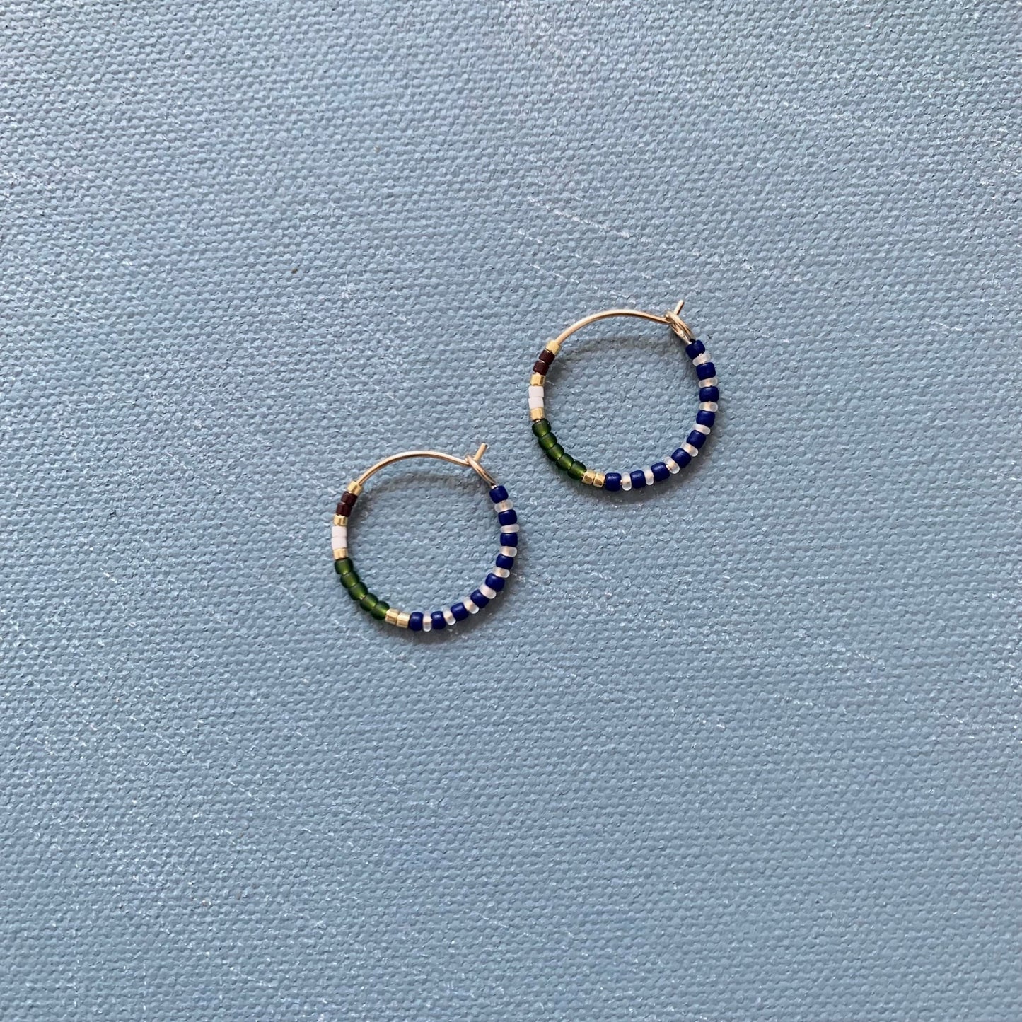 small beaded hoop in olive green multi