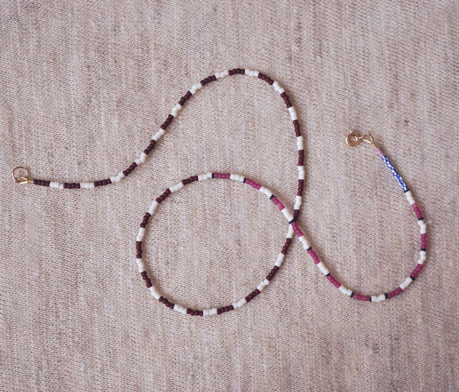 beaded stripe necklace on neutral background