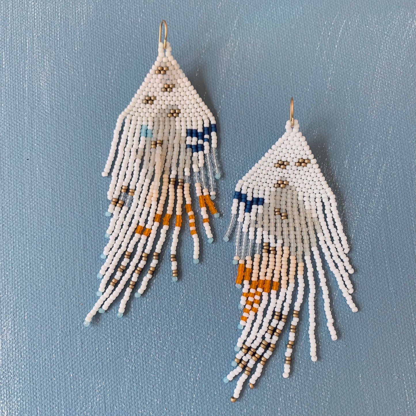 earrings in creamsicle