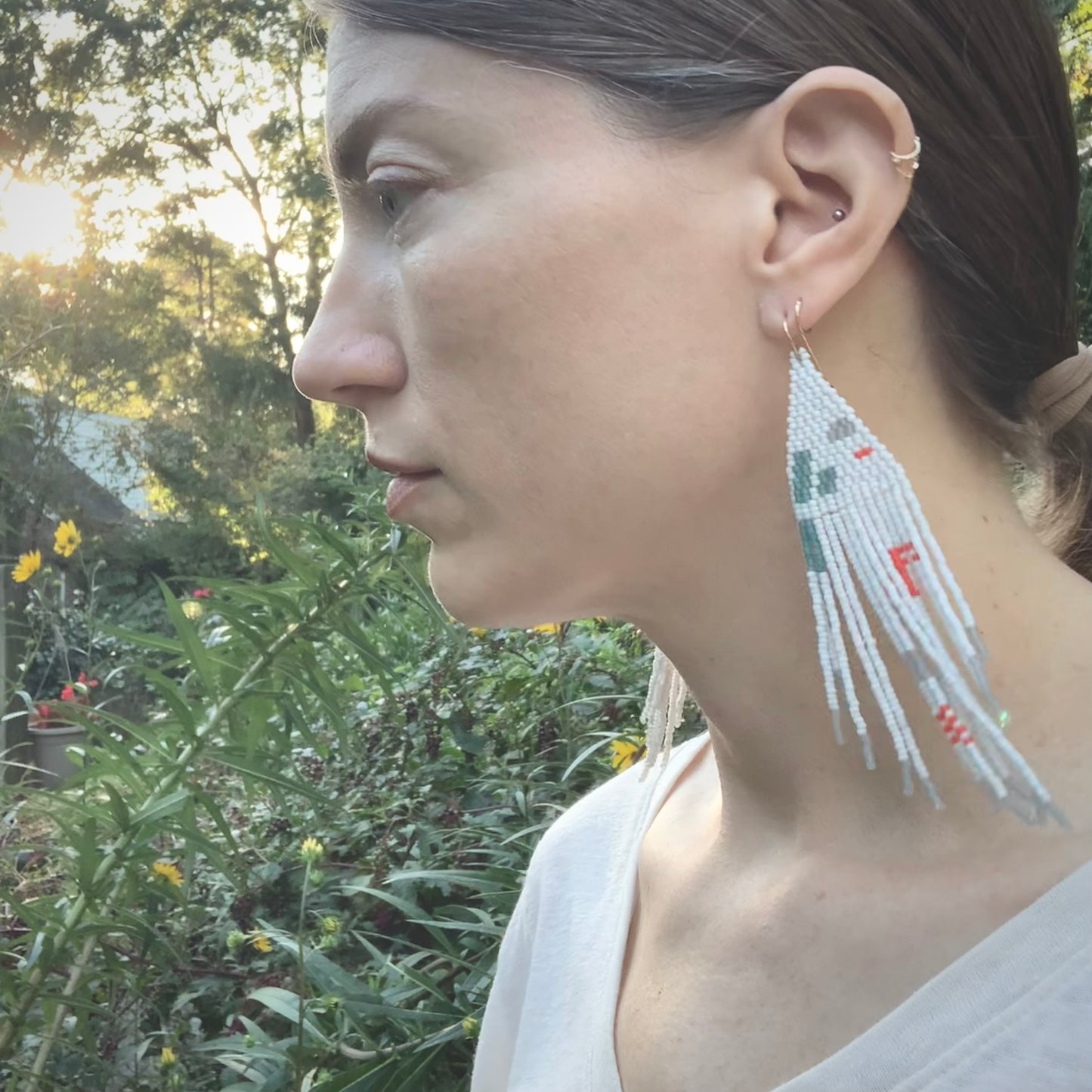 feather earrings in baby blue