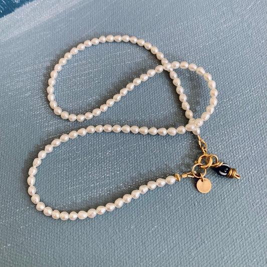 delicate baby pearl necklace with two charms