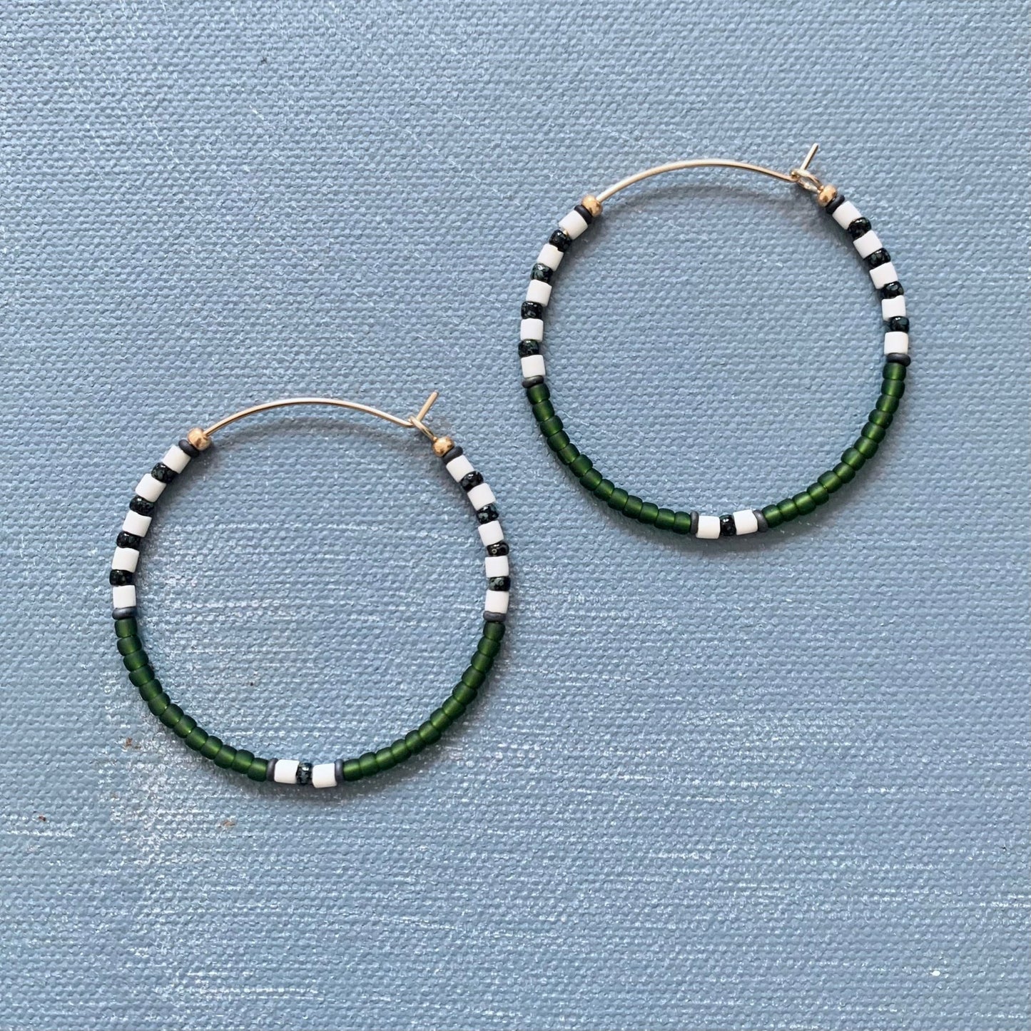 big beaded hoops in emerald green