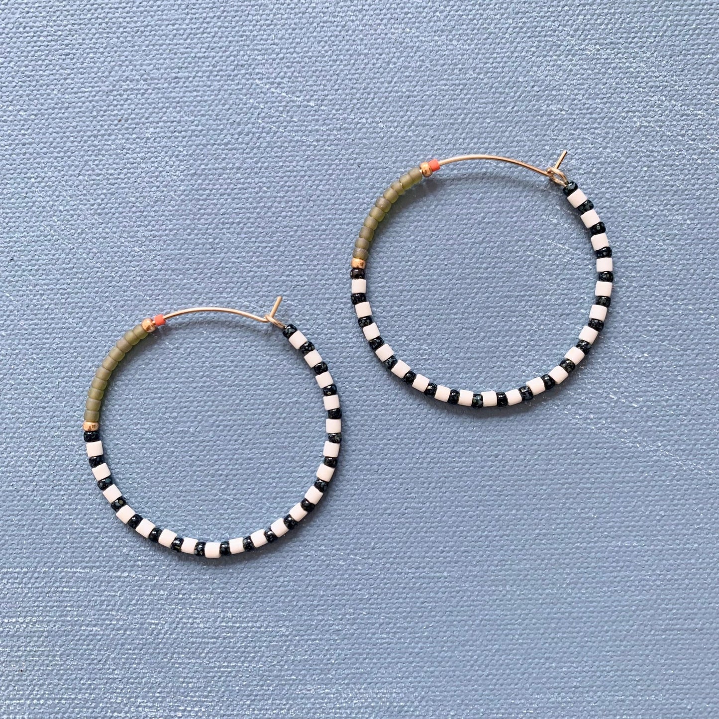 big beaded hoops in olive green stripe