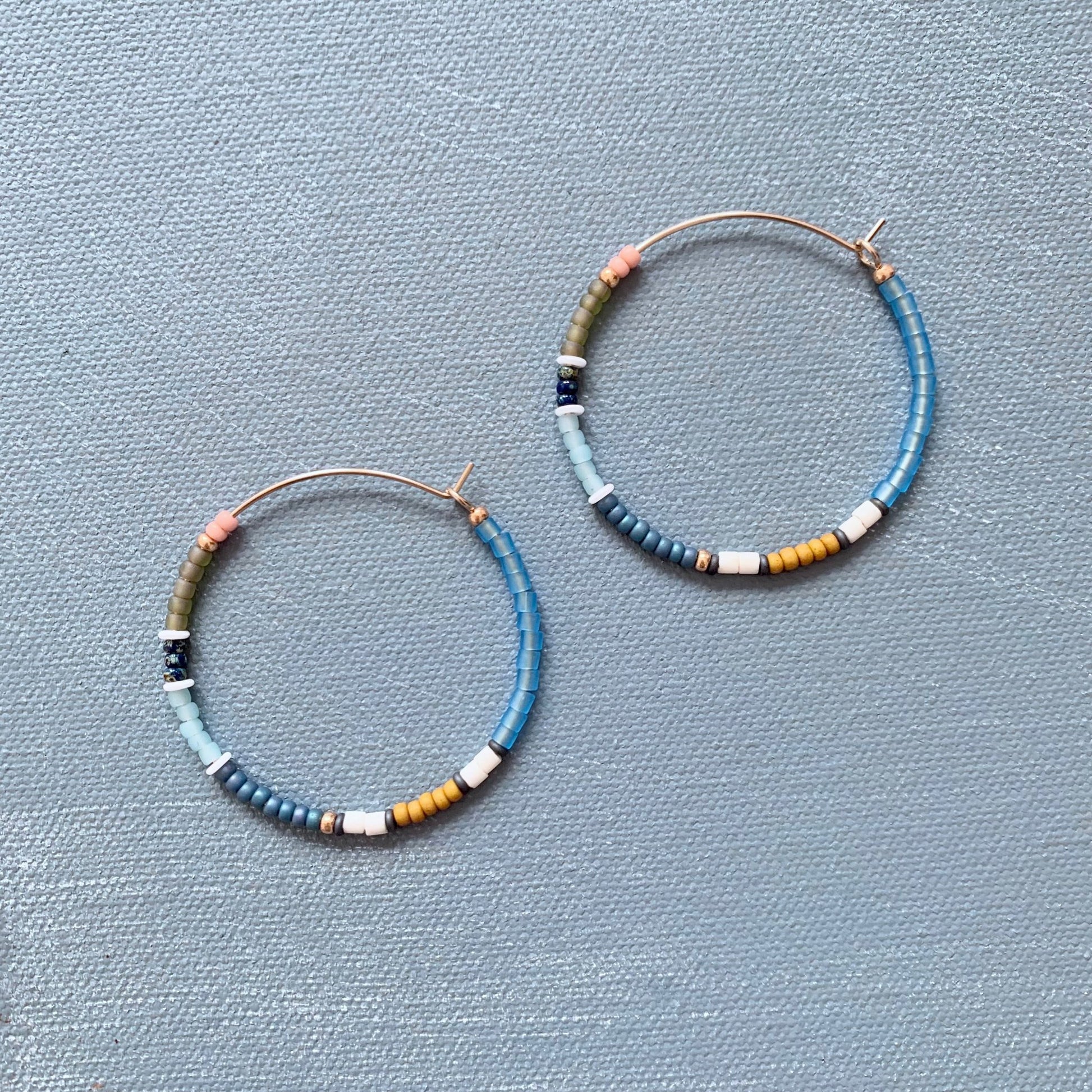 big beaded hoop earrings in blue