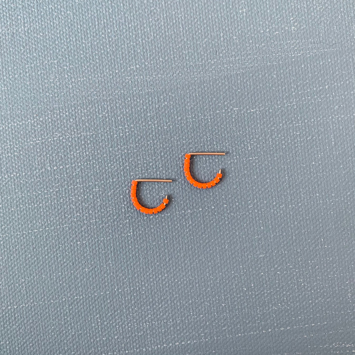 beaded huggie hoop in orange