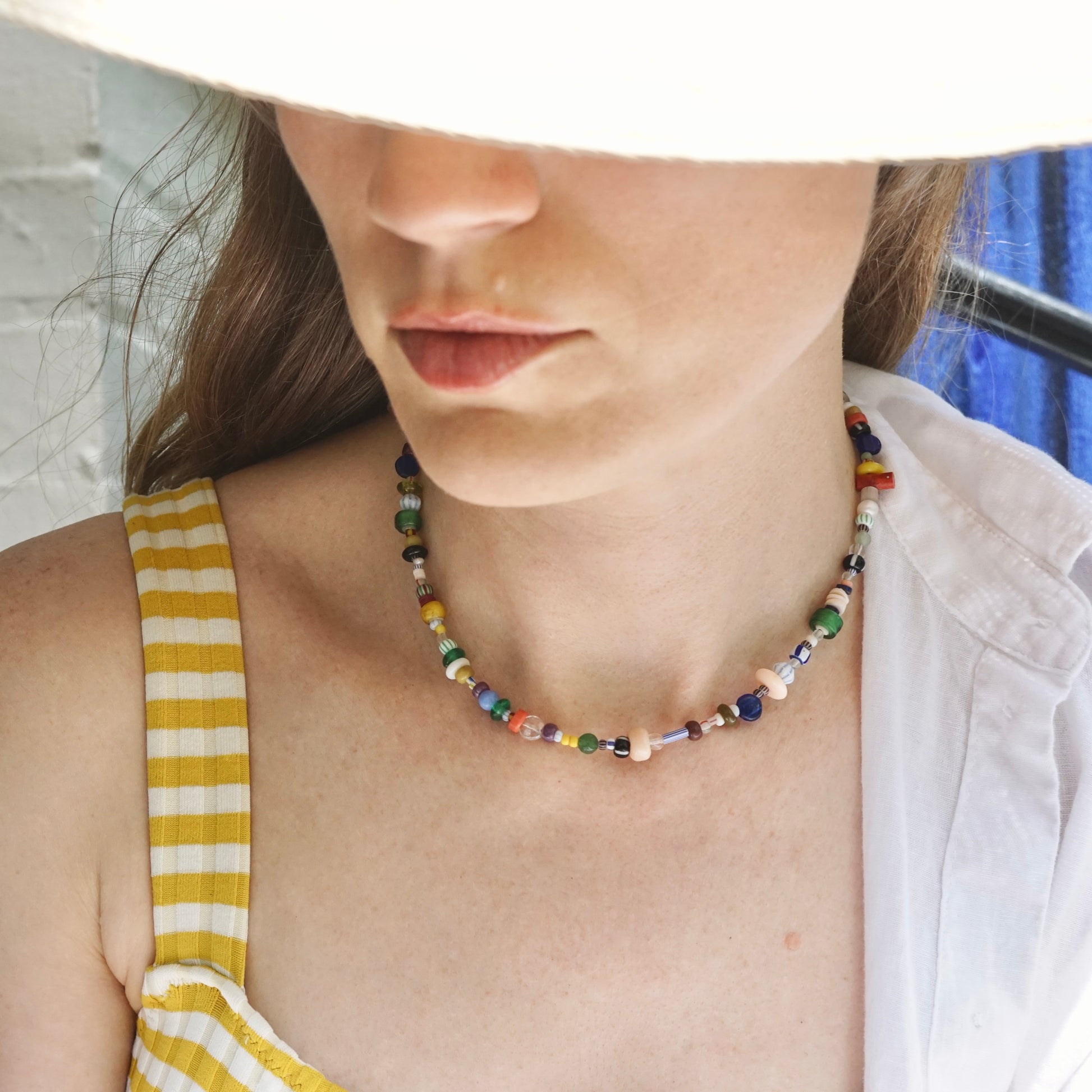 model wearing multicolored chunky beaded necklace