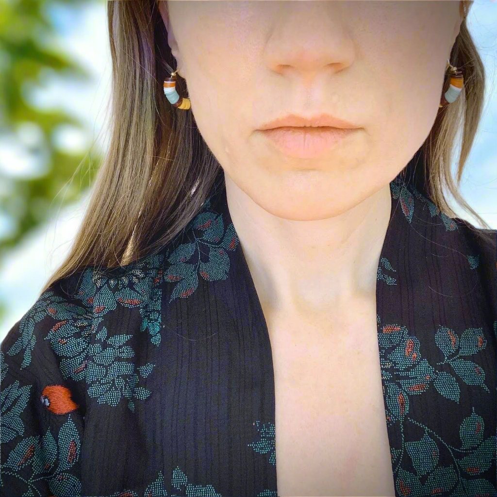 model wearing small beaded poolside hoops