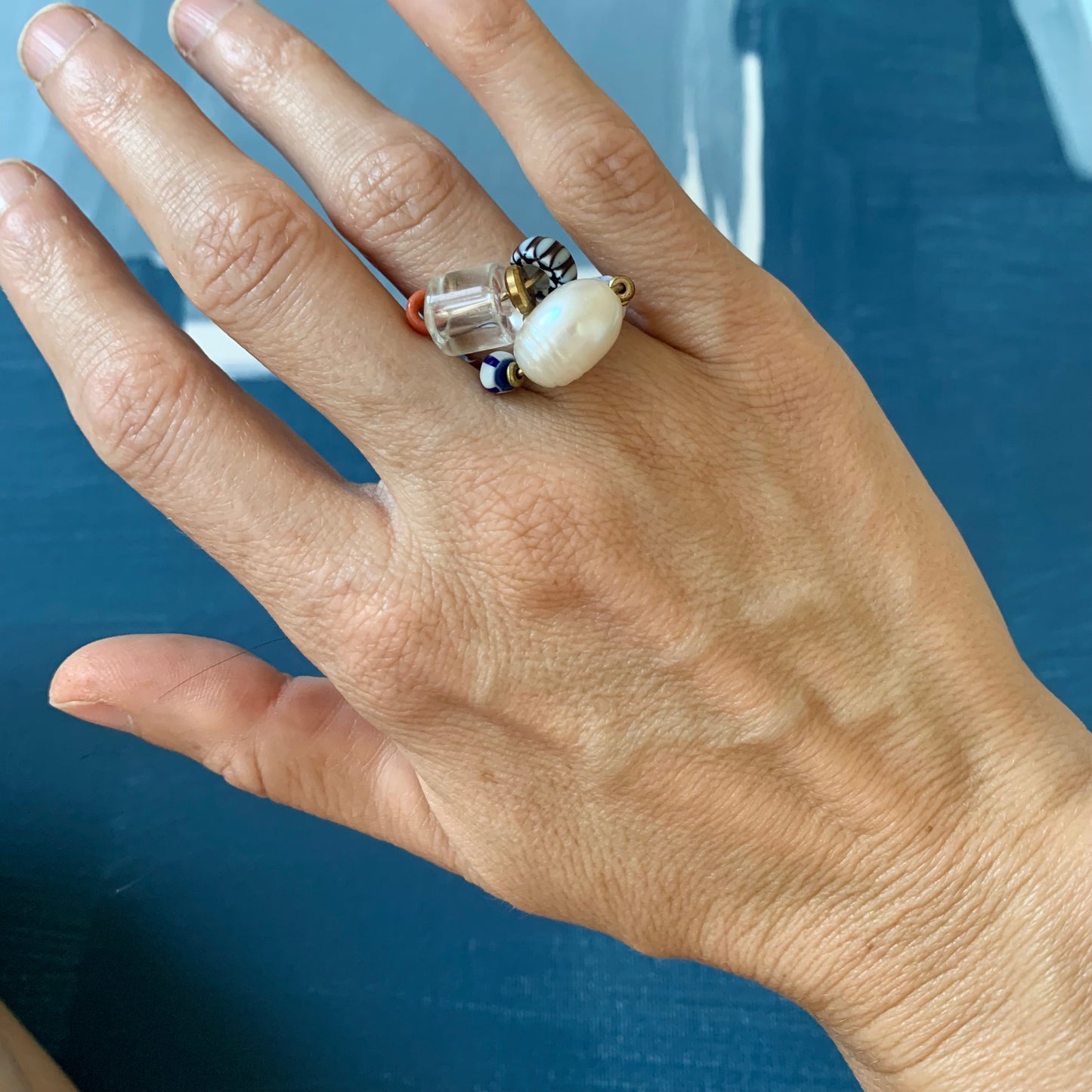 model wearing stacked beaded rings