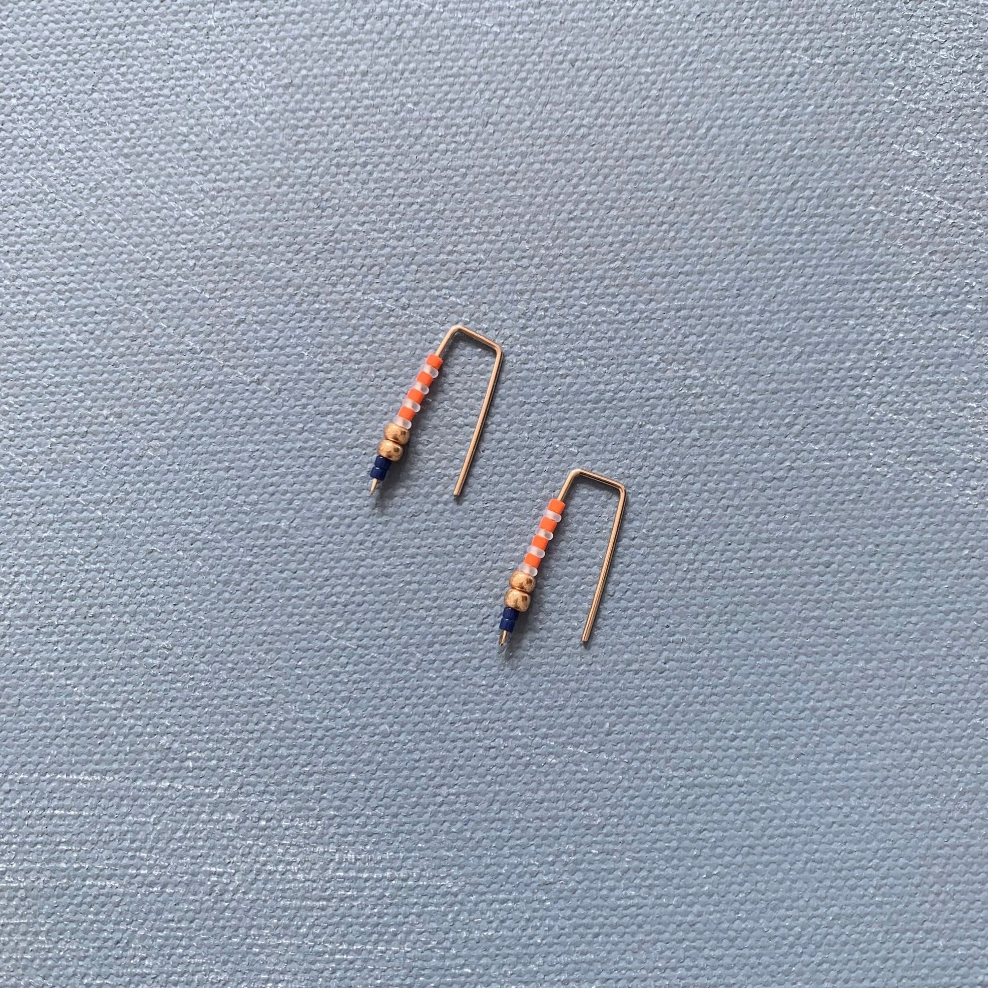 small beaded staple earrings in orange