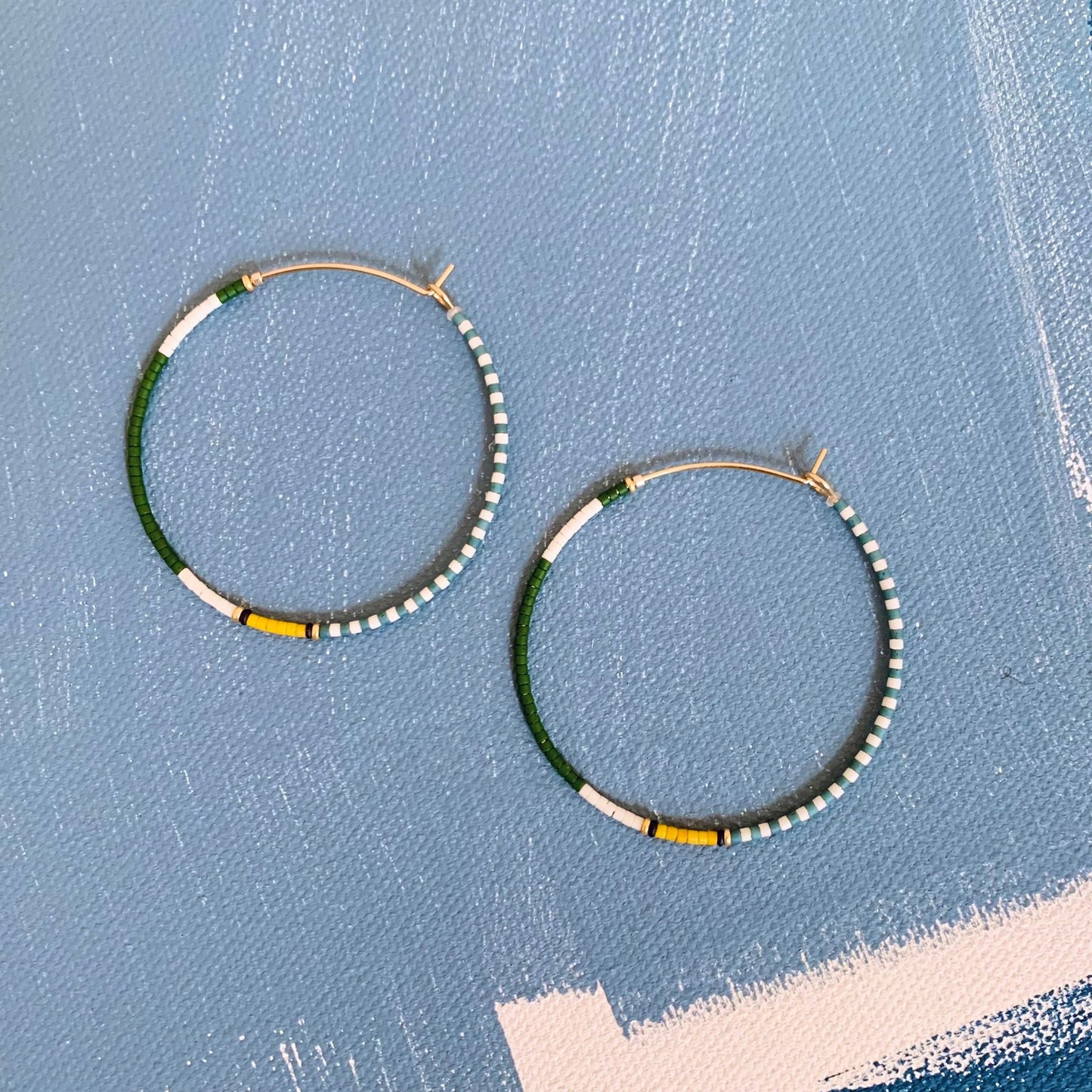 large beaded hoops in green